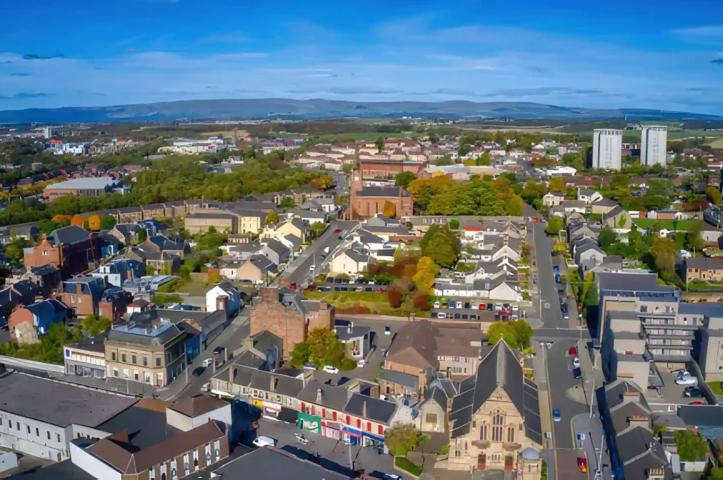 Aerial view of urban locations in Coatbridge, Scotland, featuring historic architecture and modern buildings.